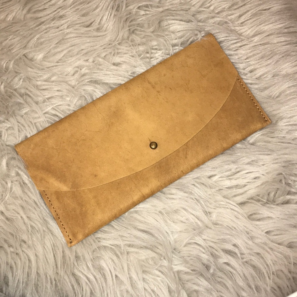 Small tan clutch